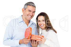 Happy couple opening present