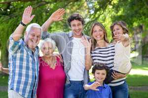 Smiling family waving hands