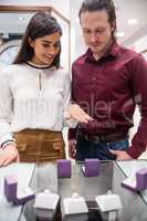 Couple selecting a finger ring