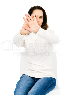 Unhappy woman hiding her face with hands