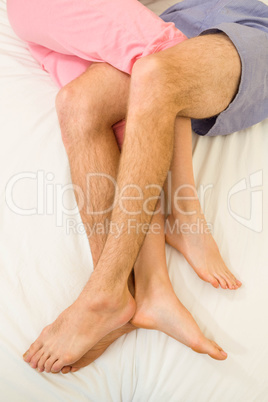 Close up of couple legs around each other