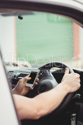 Delivery man driving his van