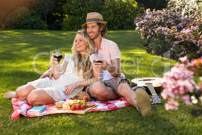 Happy couple having a picnic and embracing