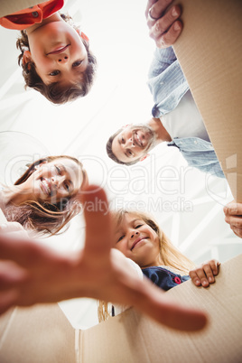 Happy family with cardboard boxes