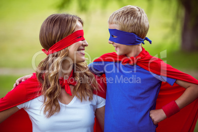 Mother and son pretending to be superhero