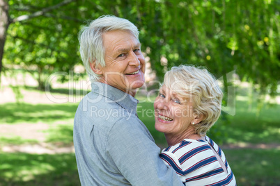 Rear view of senior couple embracing