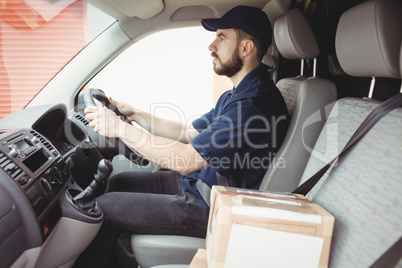 Delivery man driving his van