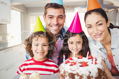 Portrait of happy family celebrating birthday