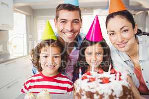 Portrait of happy family celebrating birthday