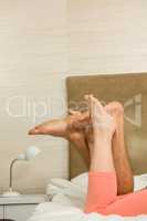 Close up of feet of cute couple lying in bed