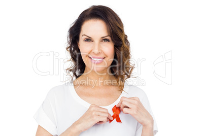 Woman wearing red aids awareness ribbon