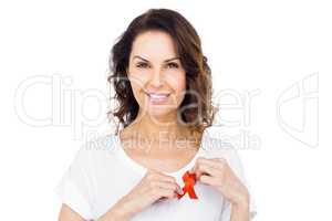 Woman wearing red aids awareness ribbon