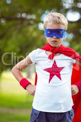 Little boy pretending to be superhero