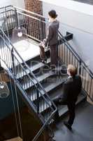 Businesspeople climbing the staircase