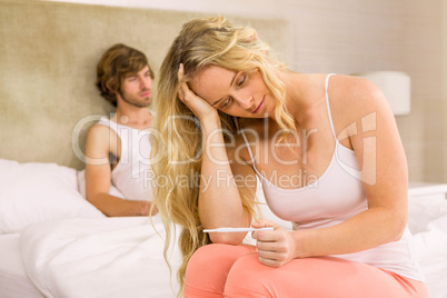 Worried woman waiting the pregnancy test result