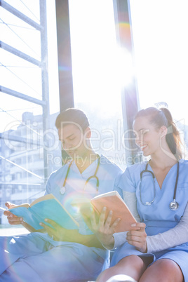 Medical team reading book