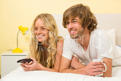 Cute couple watching TV