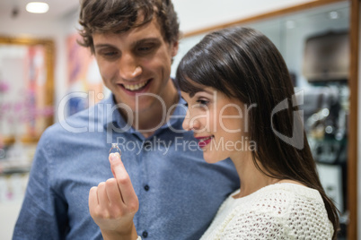 Couple looking at finger ring