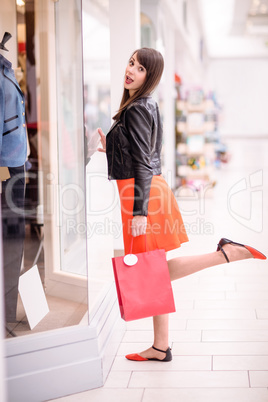 Portrait of beautiful woman window shopping