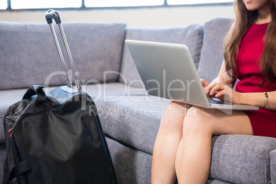 Close-up of business woman using laptop