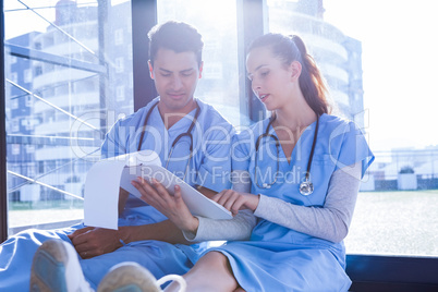 Medical team interacting notepad