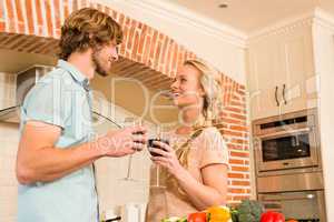 Cute couple enjoying a glass of wine