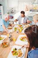 Family sitting at dining table
