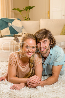 Cute couple lying on the carpet