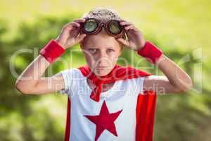 Little boy pretending to be superhero