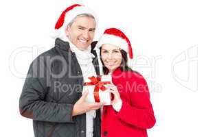 Festive couple holding christmas gift
