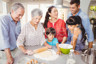 Senior woman preparing food with family