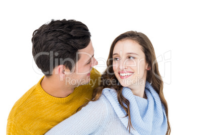 Smiling couple embracing and looking each other