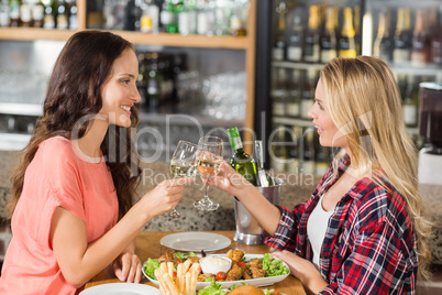 Women toasting with white wine