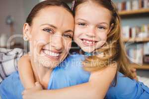 Portrait of cheerful mother and daughter