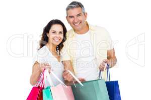 Attractive couple holding shopping bags