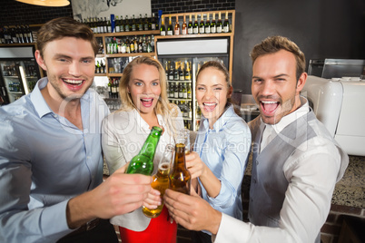 Friends toasting with bottles of beer