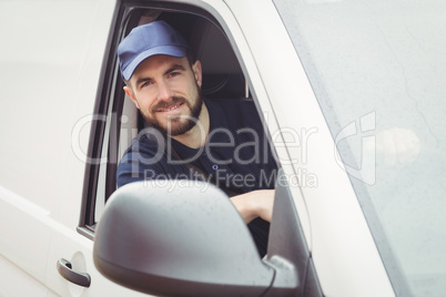 Delivery man sitting in his van
