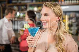 Attractive woman holding cocktail glass