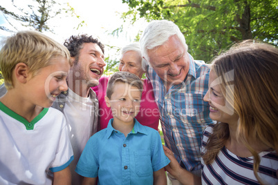 Smiling family standing and laughing