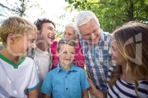 Smiling family standing and laughing