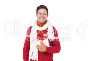 Handsome man with winter clothes holding gift box