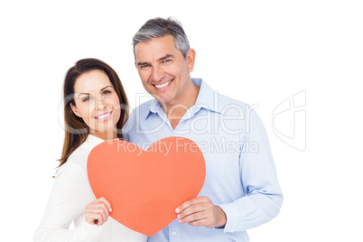 Lovely couple holding big heart