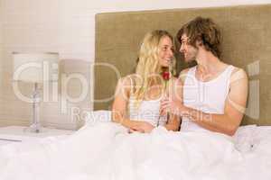 Handsome man offering a rose to his girlfriend