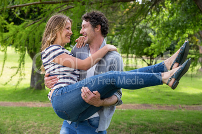 Husband carrying his wife Husband carrying his wife