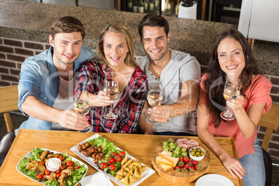 Friends toasting with white wine