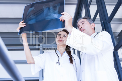 Doctors examining a x report