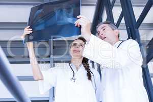 Doctors examining a x report