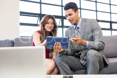 Businesswoman and businessman in office