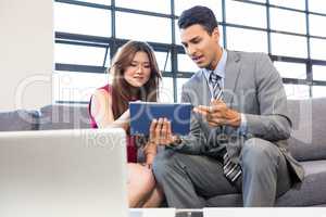 Businesswoman and businessman in office