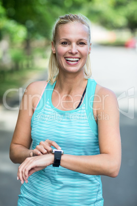 Sportswoman checking her heart rate watch